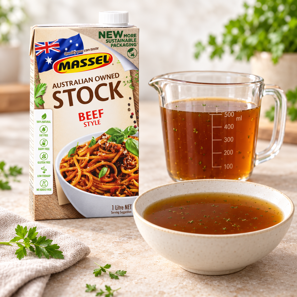Massel Organic Liquid Stock Beef Style being poured into a saucepan.